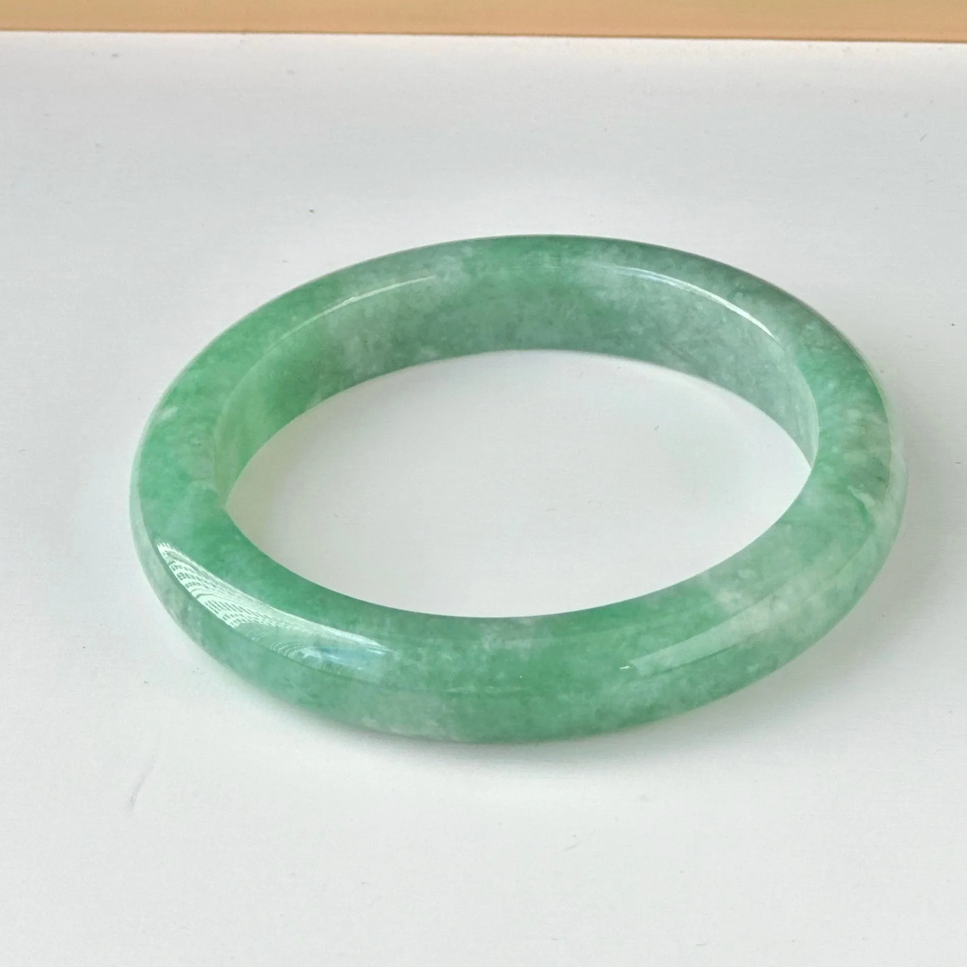 122858 57.7mm Full Apple Green Jadeite Bangle