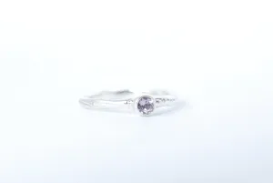 Silver stacking ring with amethyst gemstone.