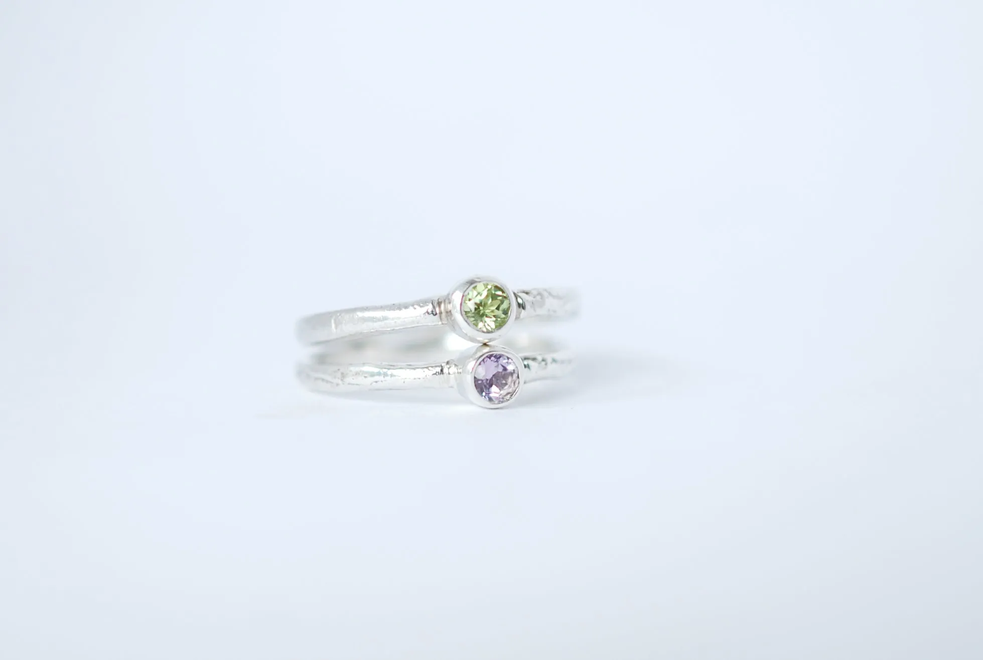 Silver stacking ring with amethyst gemstone.